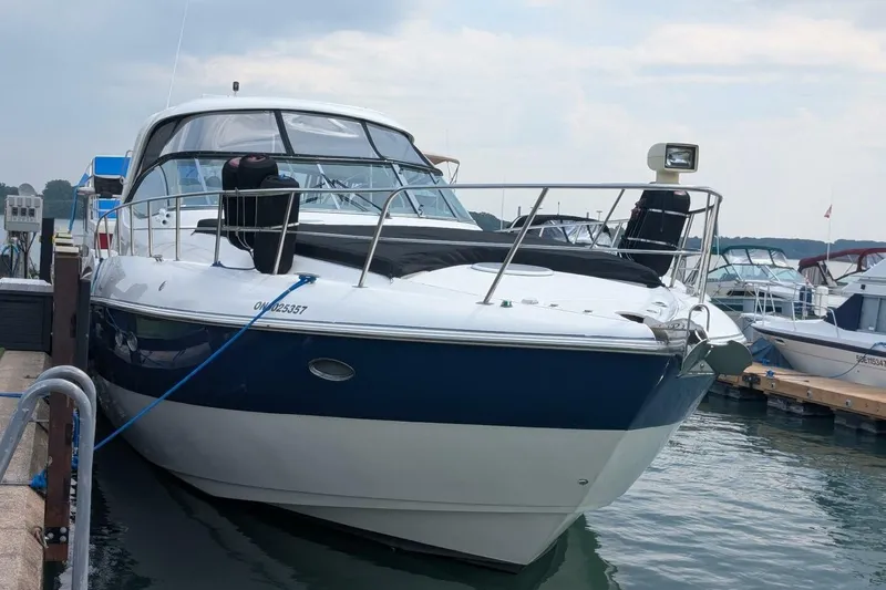  Yacht Photos Pics 2007 Cruisers Yachts 520 Express docked at marina, sleek design, blue and white exterior.