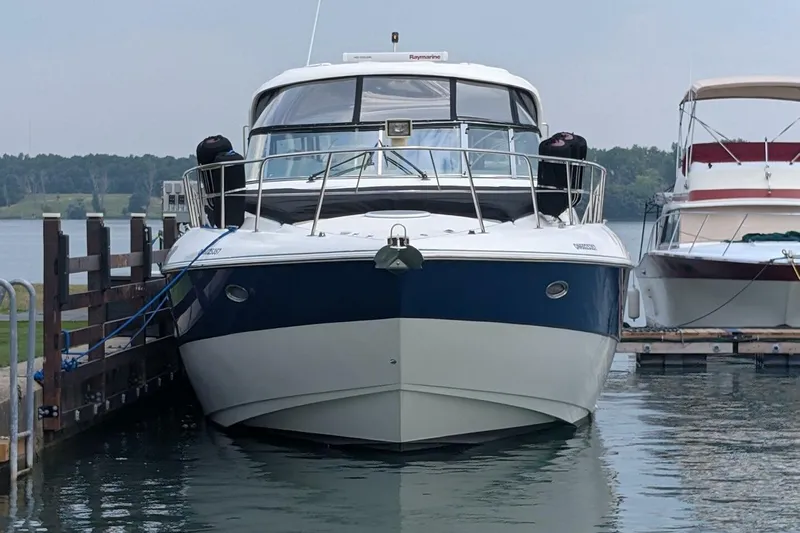  Yacht Photos Pics 2007 Cruisers Yachts 520 Express docked at marina, front view.