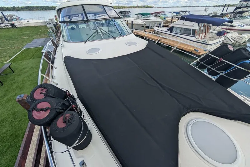  Yacht Photos Pics 2007 Cruisers Yachts 520 Express docked, featuring a covered deck and scenic marina view.