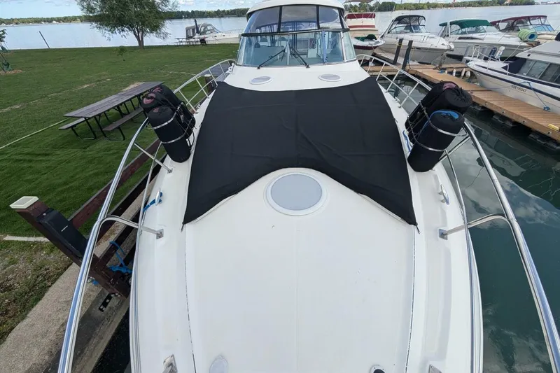  Yacht Photos Pics 2007 Cruisers Yachts 520 Express docked, featuring spacious deck and sleek design.