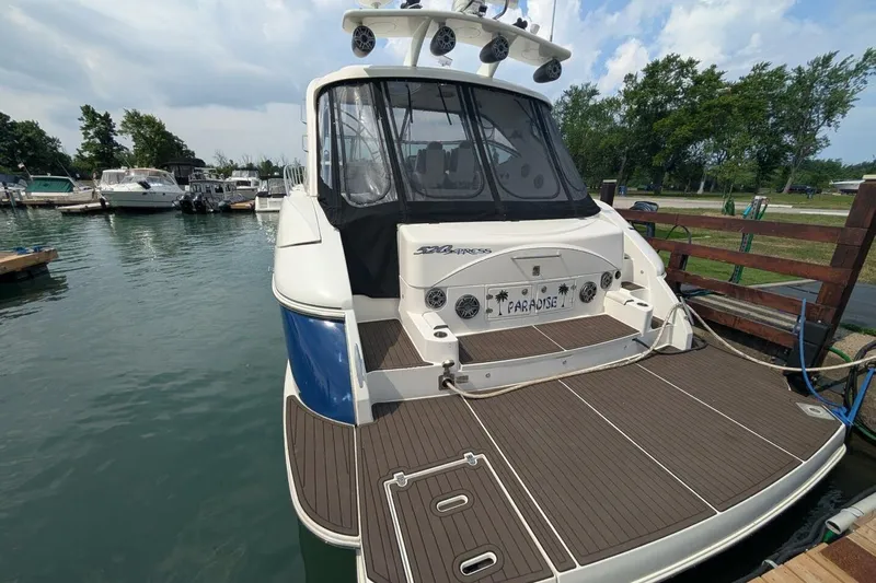  Yacht Photos Pics 2007 Cruisers Yachts 520 Express docked at marina, rear view.