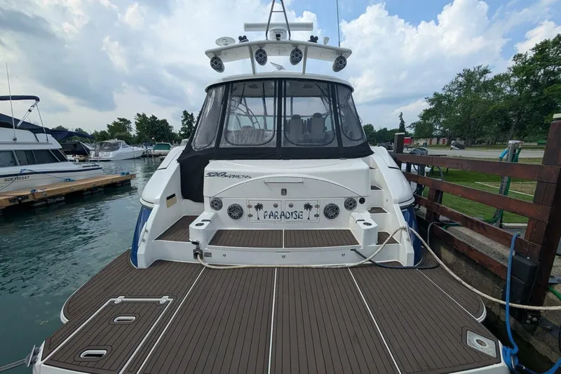  Yacht Photos Pics 2007 Cruisers Yachts 520 Express docked, featuring spacious deck and sleek design.