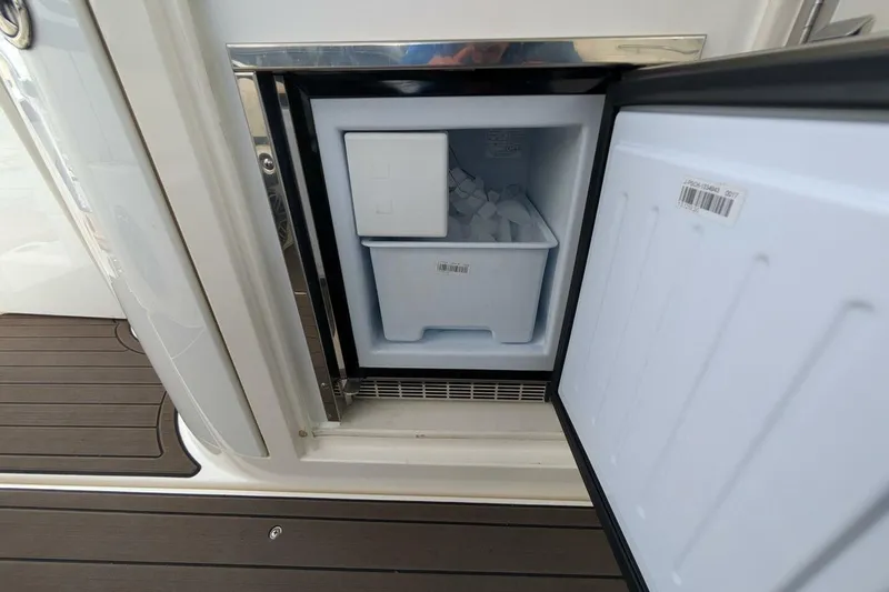  Yacht Photos Pics Open ice maker on 2007 Cruisers Yachts 520 Express, showing ice compartment.