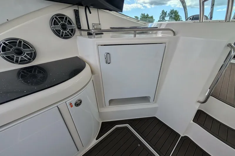  Yacht Photos Pics 2007 Cruisers Yachts 520 Express interior with speakers and storage cabinet.