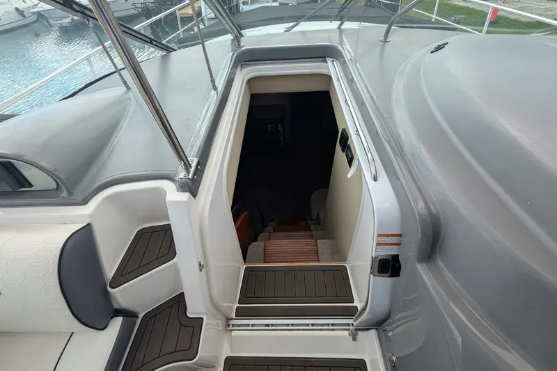  Yacht Photos Pics 2007 Cruisers Yachts 520 Express cabin entrance with wooden steps and sleek design.