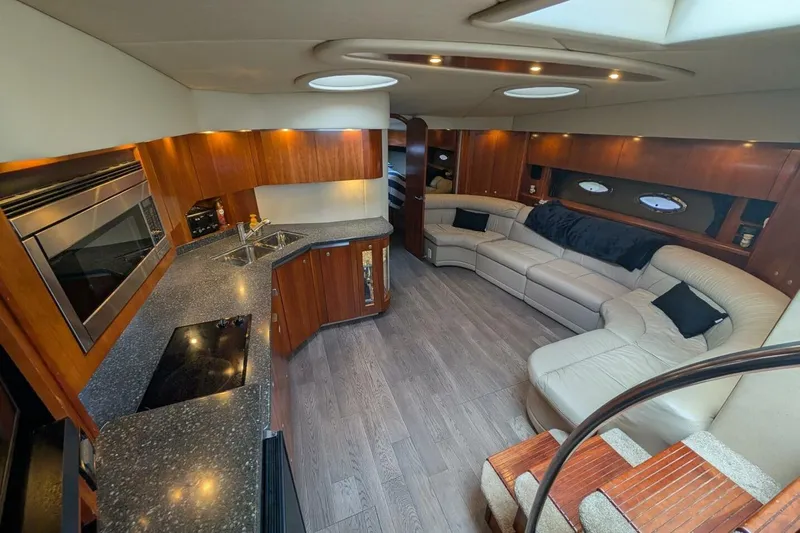  Yacht Photos Pics Luxurious interior of 2007 Cruisers Yachts 520 Express with modern kitchen and spacious seating.