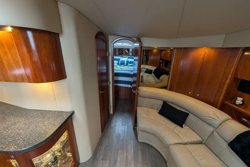  Yacht Photos Pics Luxurious 2007 Cruisers Yachts 520 Express interior with elegant wood finishes and plush seating.