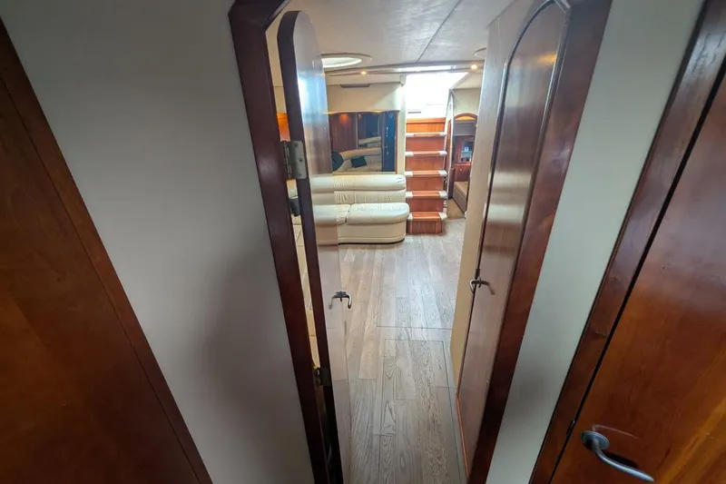  Yacht Photos Pics 2007 Cruisers Yachts 520 Express interior with wood flooring and beige seating.