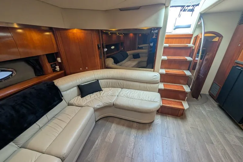  Yacht Photos Pics Luxurious interior of 2007 Cruisers Yachts 520 Express with leather seating and wooden accents.