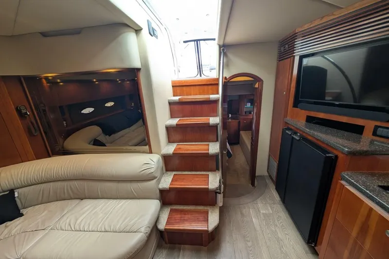  Yacht Photos Pics Luxurious interior of 2007 Cruisers Yachts 520 Express with stairs, seating, and entertainment area.
