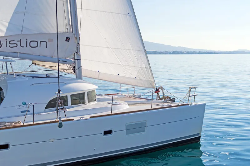 Cataki Yacht Photos Pics 2017 Lagoon 380 S2 catamaran sailing on calm blue waters.