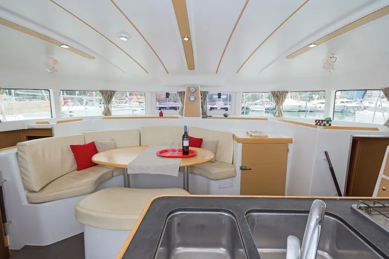 Cataki Yacht Photos Pics Interior of 2017 Lagoon 380 S2 catamaran with cozy seating and dining area.
