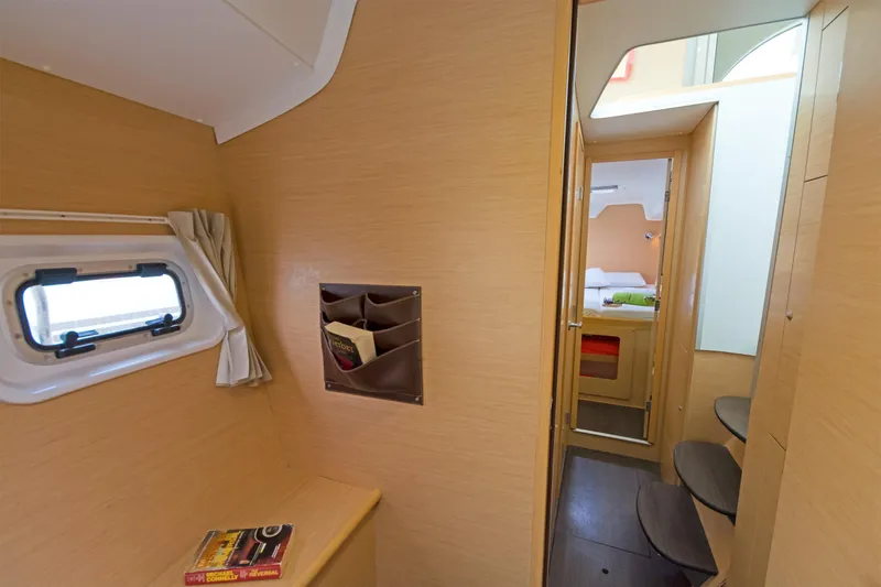 Cataki Yacht Photos Pics Interior of 2017 Lagoon 380 S2 catamaran, featuring cozy cabin and wooden finishes.