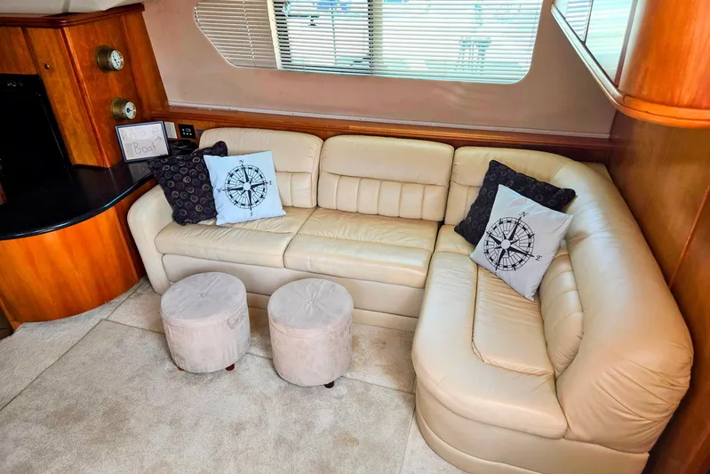  Yacht Photos Pics Luxurious interior of 2003 Silverton 392 Motor Yacht with beige leather seating and nautical decor.