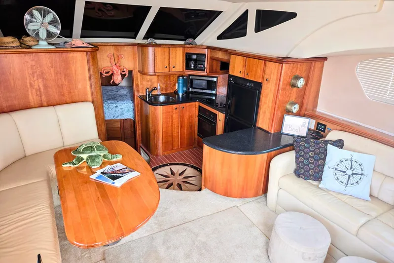  Yacht Photos Pics Luxurious interior of 2003 Silverton 392 Motor Yacht with cozy seating and kitchenette.