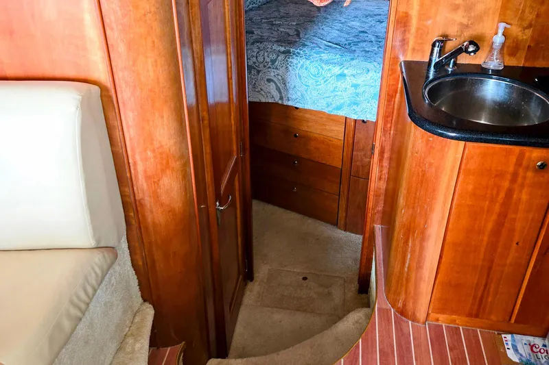  Yacht Photos Pics Interior of 2003 Silverton 392 Motor Yacht with wood cabinetry and compact sink.