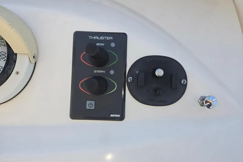  Yacht Photos Pics Control panel on a 2003 Silverton 392 Motor Yacht, featuring thruster and searchlight controls.