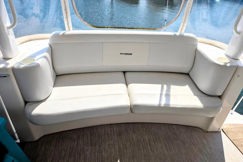  Yacht Photos Pics 2003 Silverton 392 Motor Yacht interior with white cushioned seating and cup holders.