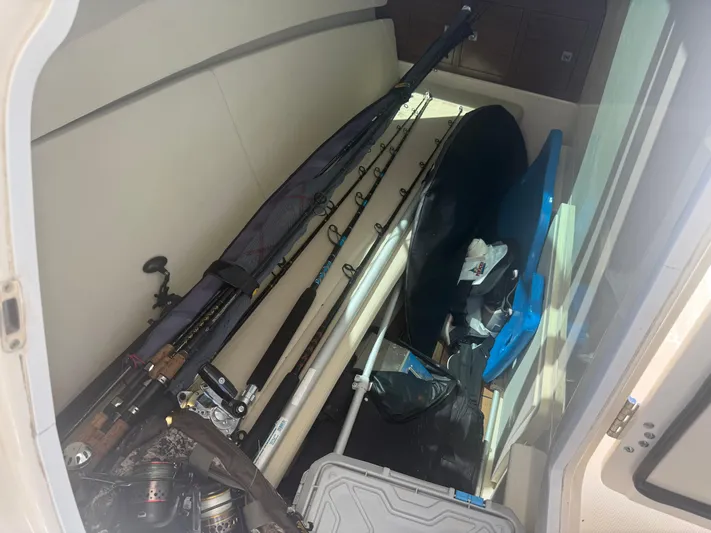 Yacht Photos Pics Storage compartment of a 2017 Boston Whaler 320 Vantage with fishing gear and equipment.