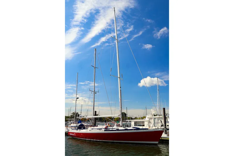 Hamburg II Yacht Photos Pics 2002 J Boats J/46 sailboat docked under a clear blue sky.