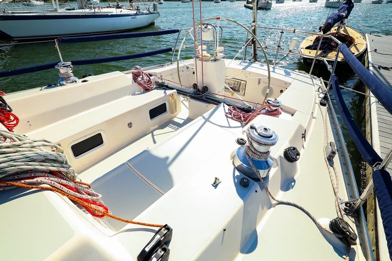 Hamburg II Yacht Photos Pics 2002 J Boats J/46 sailboat deck with winches and ropes, docked in a marina.