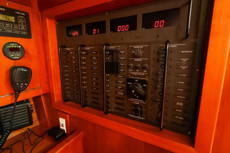 Hamburg II Yacht Photos Pics Electrical control panel on a 2002 J Boats J/46 yacht, featuring various switches and displays.