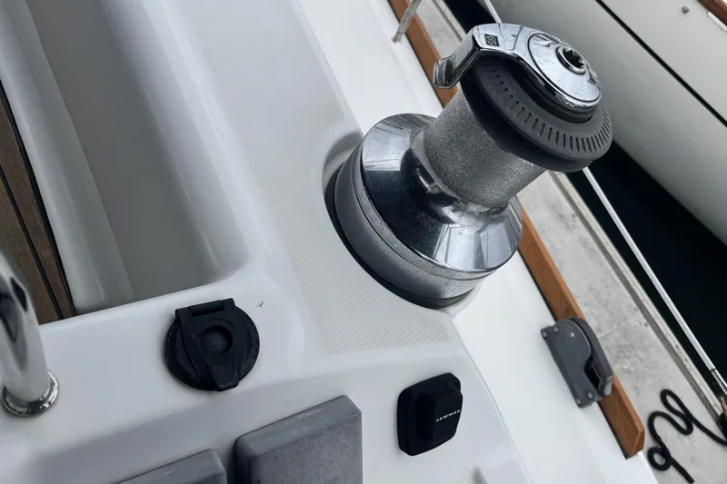 Lumiere Yacht Photos Pics Close-up of a 2007 Beneteau 49 sailboat winch and deck fittings.