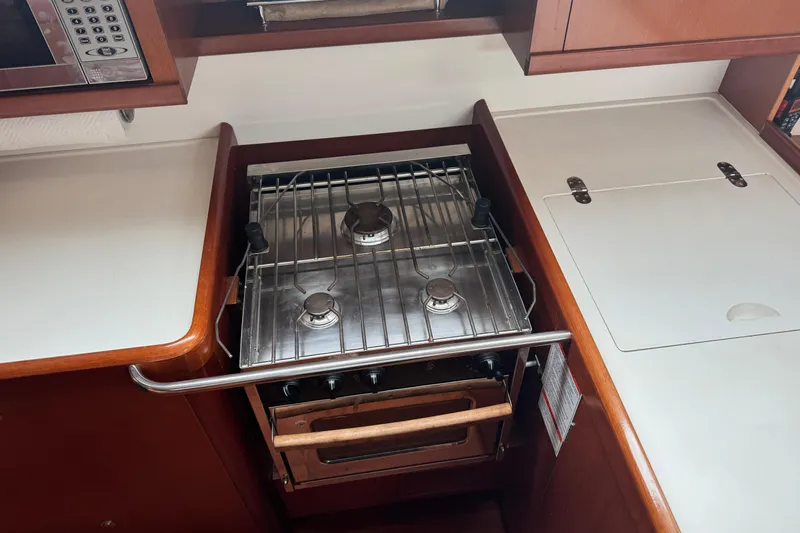 Lumiere Yacht Photos Pics Galley kitchen in 2007 Beneteau 49 yacht with stove and oven.