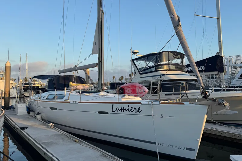 Lumiere Yacht Photos Pics 2007 Beneteau 49 sailboat named "Lumiere" docked at a marina.