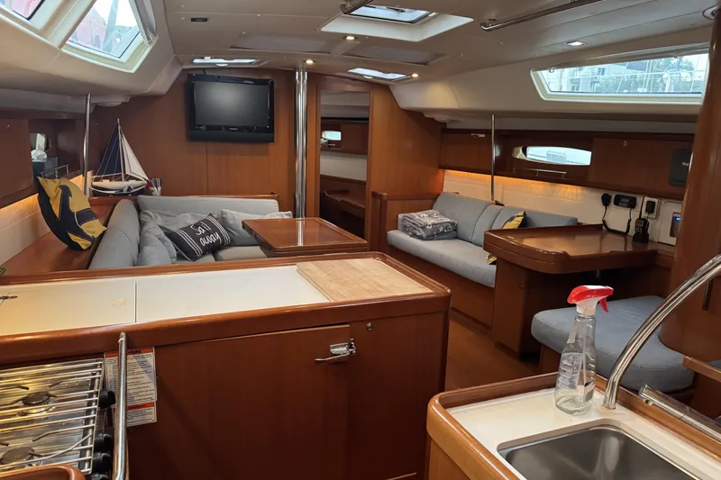 Lumiere Yacht Photos Pics Luxurious interior of a 2007 Beneteau 49 yacht with cozy seating and modern amenities.
