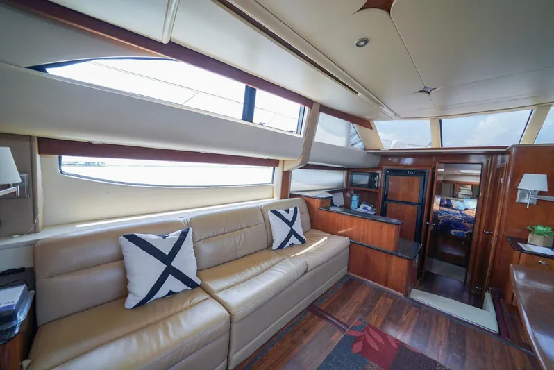 Poseidon's Mistress Yacht Photos Pics Interior of 2007 Meridian 459 Motor Yacht with leather seating and modern decor.