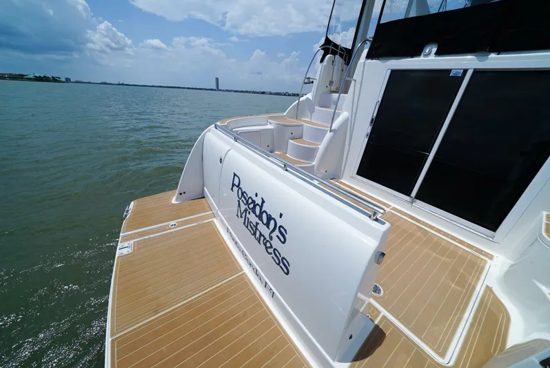 Poseidon's Mistress Yacht Photos Pics 2007 Meridian 459 Motor Yacht on water with teak deck and custom name.