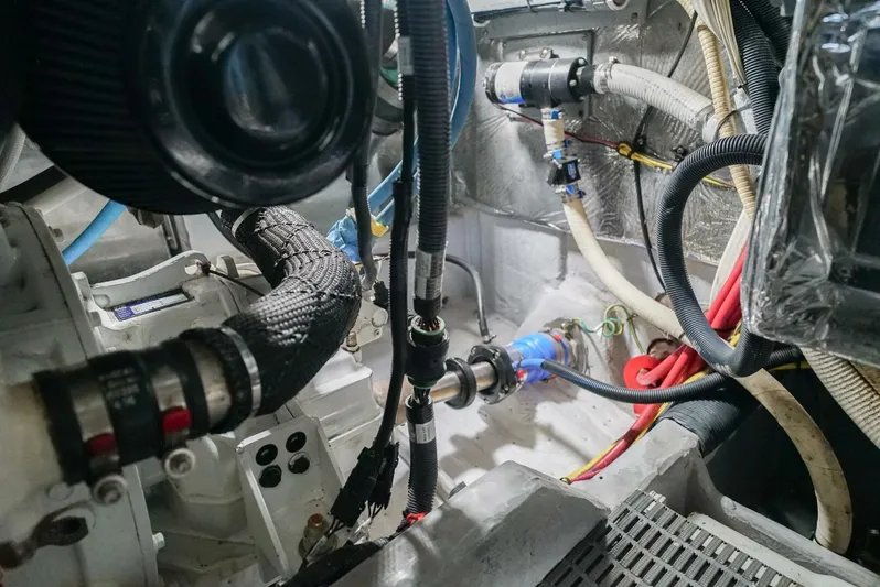 Poseidon's Mistress Yacht Photos Pics Engine room of a 2007 Meridian 459 Motor Yacht with various hoses and components.