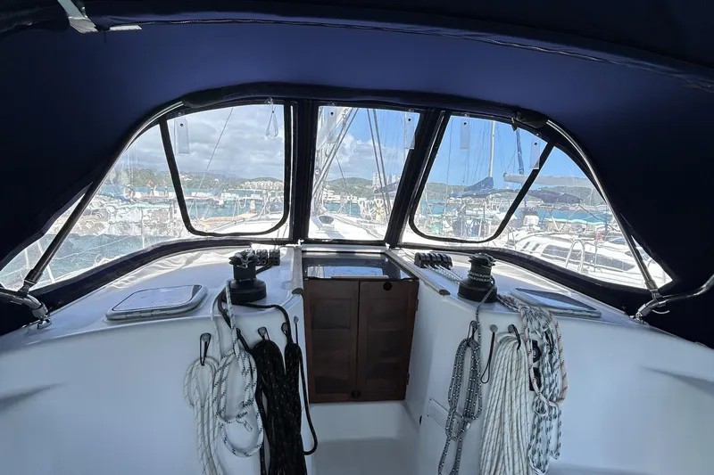 Pau Hana Yacht Photos Pics Cockpit view of 2007 Beneteau Cyclades 50.3 sailboat with ropes and winches.
