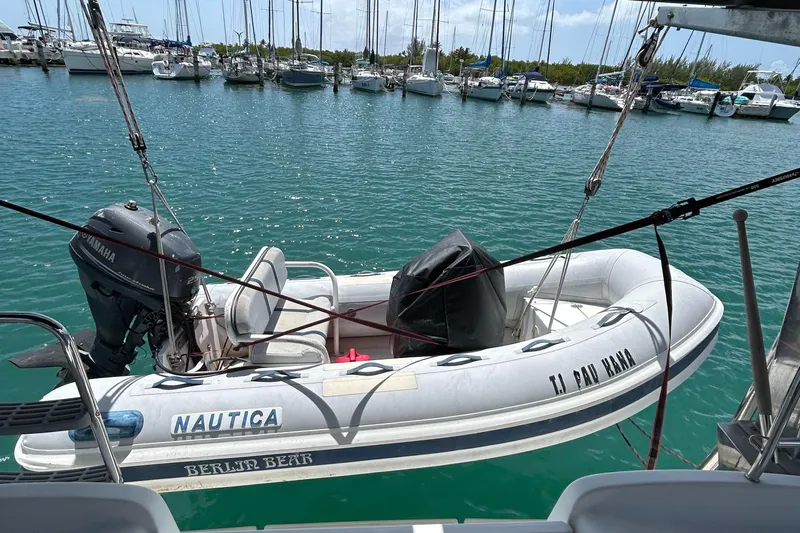 Pau Hana Yacht Photos Pics Inflatable dinghy with Yamaha motor on Beneteau Cyclades 50.3, 2007, docked in marina.