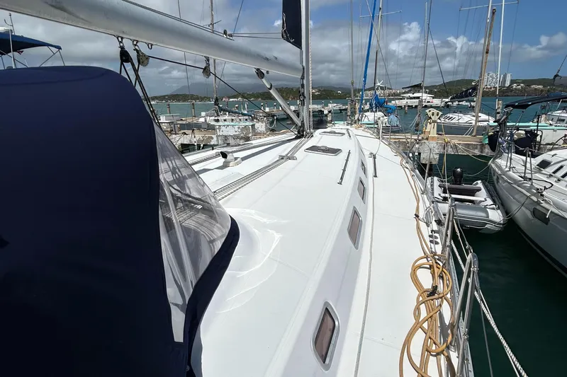 Pau Hana Yacht Photos Pics Sailing yacht Beneteau Cyclades 50.3, 2007 model, docked in a marina with clear skies.