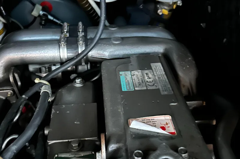 Pau Hana Yacht Photos Pics Engine compartment of a 2007 Beneteau Cyclades 50.3 sailboat, showing mechanical components.