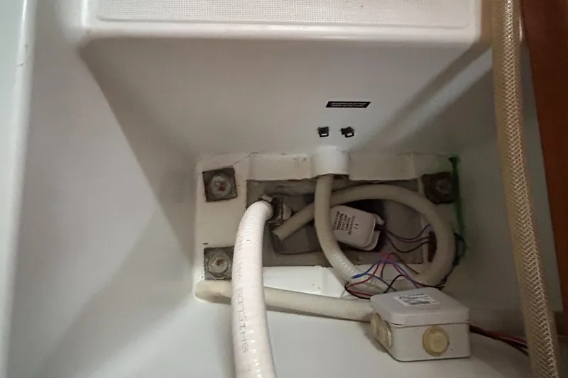 Pau Hana Yacht Photos Pics Beneteau Cyclades 50.3 2007 yacht interior showing plumbing and wiring components.