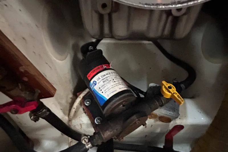 Pau Hana Yacht Photos Pics Engine compartment of a 2007 Beneteau Cyclades 50.3, featuring an oil change pump.