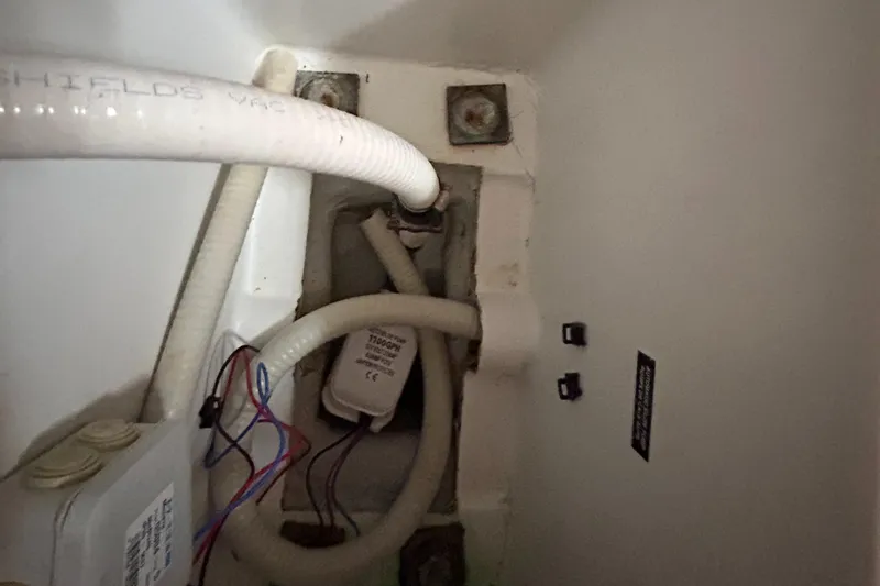 Pau Hana Yacht Photos Pics Interior view of 2007 Beneteau Cyclades 50.3 yacht showing plumbing and wiring components.