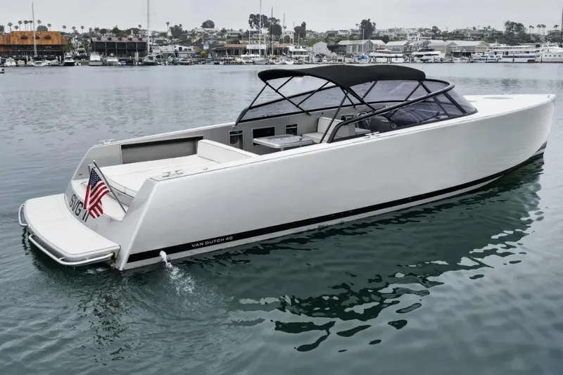 Svg II Yacht Photos Pics 2016 VanDutch CRUISER yacht on calm water, featuring sleek design and American flag.