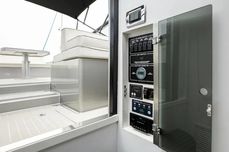 Svg II Yacht Photos Pics Control panel on 2016 VanDutch CRUISER yacht, featuring switches and battery monitor.