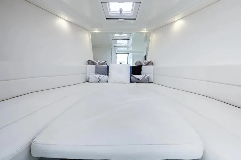 Svg II Yacht Photos Pics Luxurious interior of 2016 VanDutch CRUISER with plush white seating and modern design.