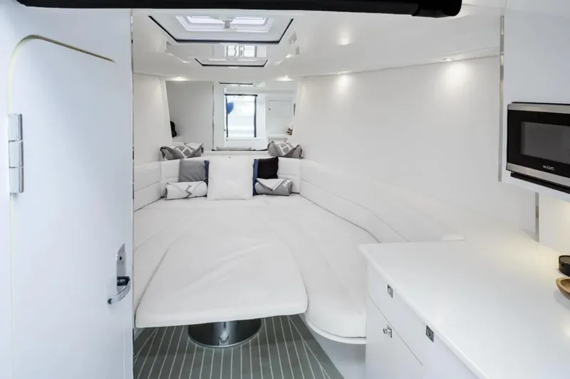 Svg II Yacht Photos Pics Luxurious interior of 2016 VanDutch CRUISER yacht with modern white furnishings.