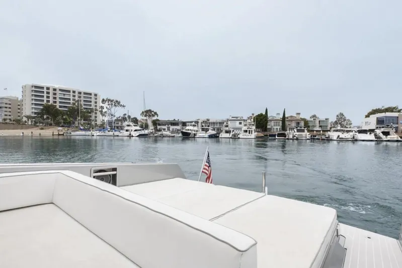 Svg II Yacht Photos Pics 2016 VanDutch CRUISER yacht in a marina with waterfront buildings and boats.