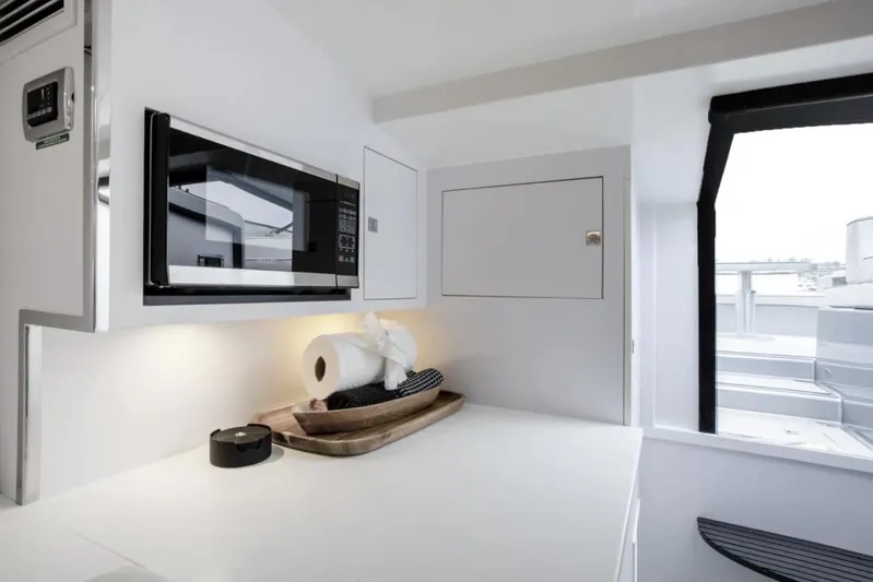 Svg II Yacht Photos Pics Modern kitchen interior of 2016 VanDutch CRUISER yacht with microwave and sleek design.