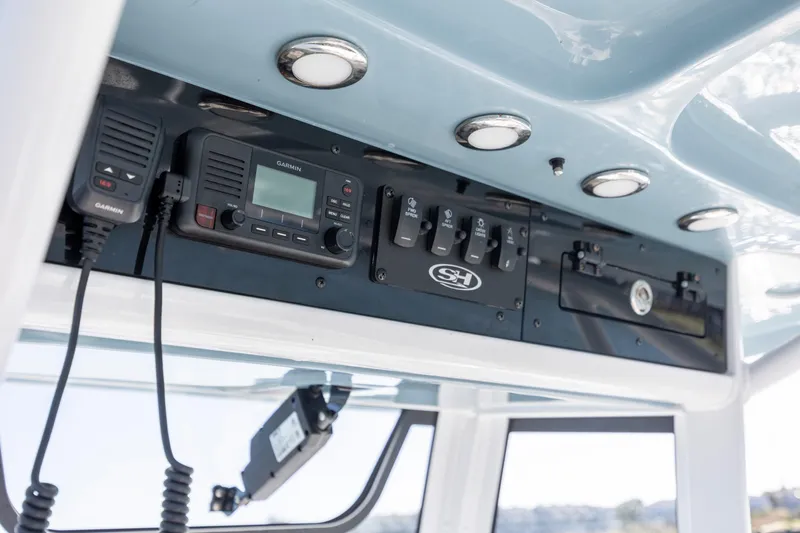  Yacht Photos Pics 2024 Sea Hunt Escape 28 boat dashboard with Garmin radio and control panel.