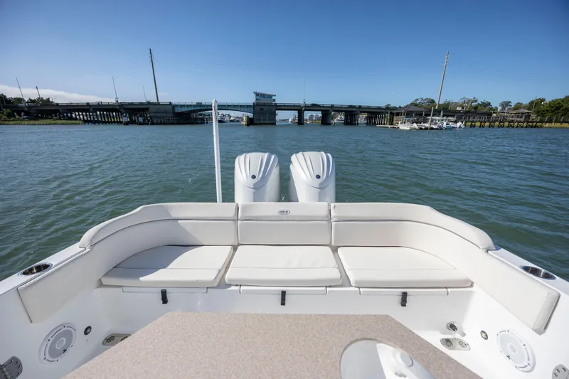  Yacht Photos Pics 2024 Sea Hunt Escape 28 boat with spacious seating, cruising on a sunny day.