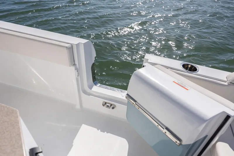  Yacht Photos Pics 2024 Sea Hunt Escape 28 boat deck with open door, overlooking water.