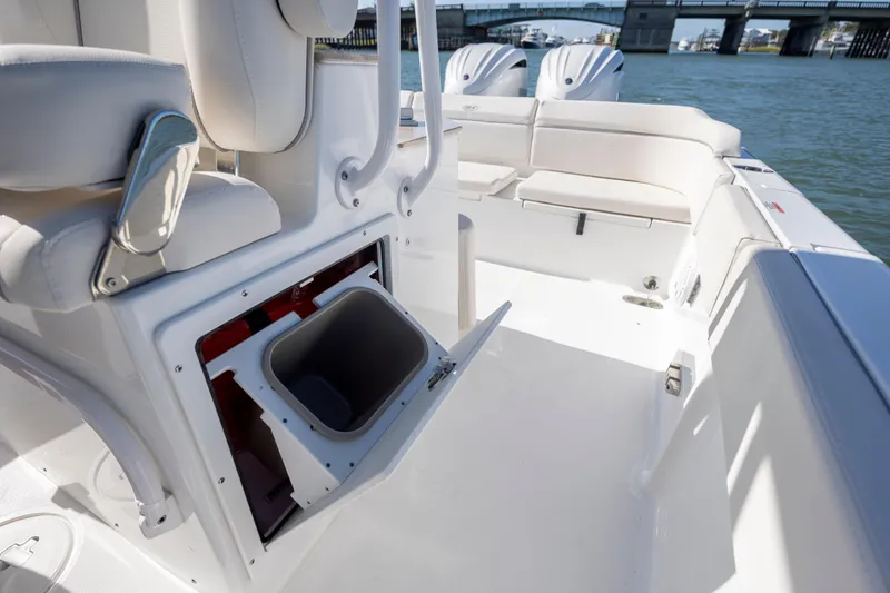  Yacht Photos Pics 2024 Sea Hunt Escape 28 boat interior with storage compartment and seating.